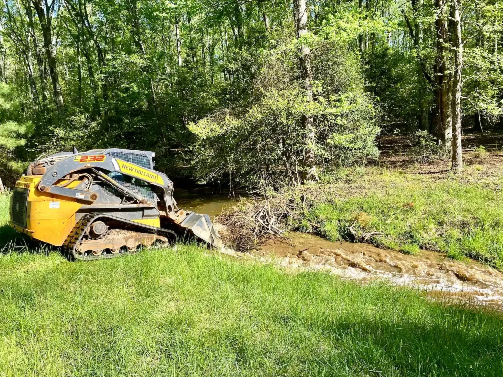 clearing beaver dam